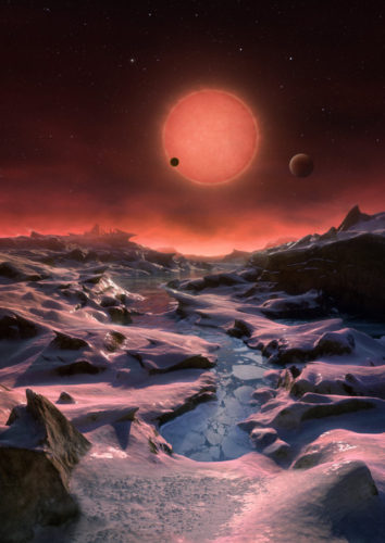 Concetto artistico della stella TRAPPIST-1 e dei suoi pianeti visti da uno di essi (Immagine ESO/M. Kornmesser)